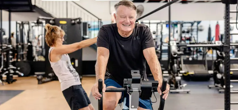 man on indoor bike.png