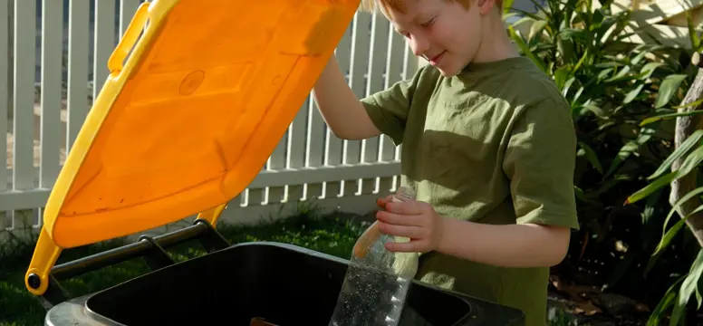 Boy recycling