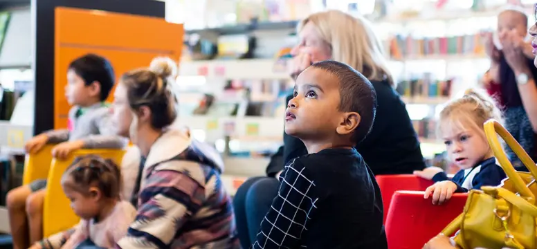 Child sitting in chair at Subiaco Library