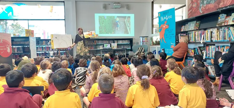 Briony reads her book to the kids