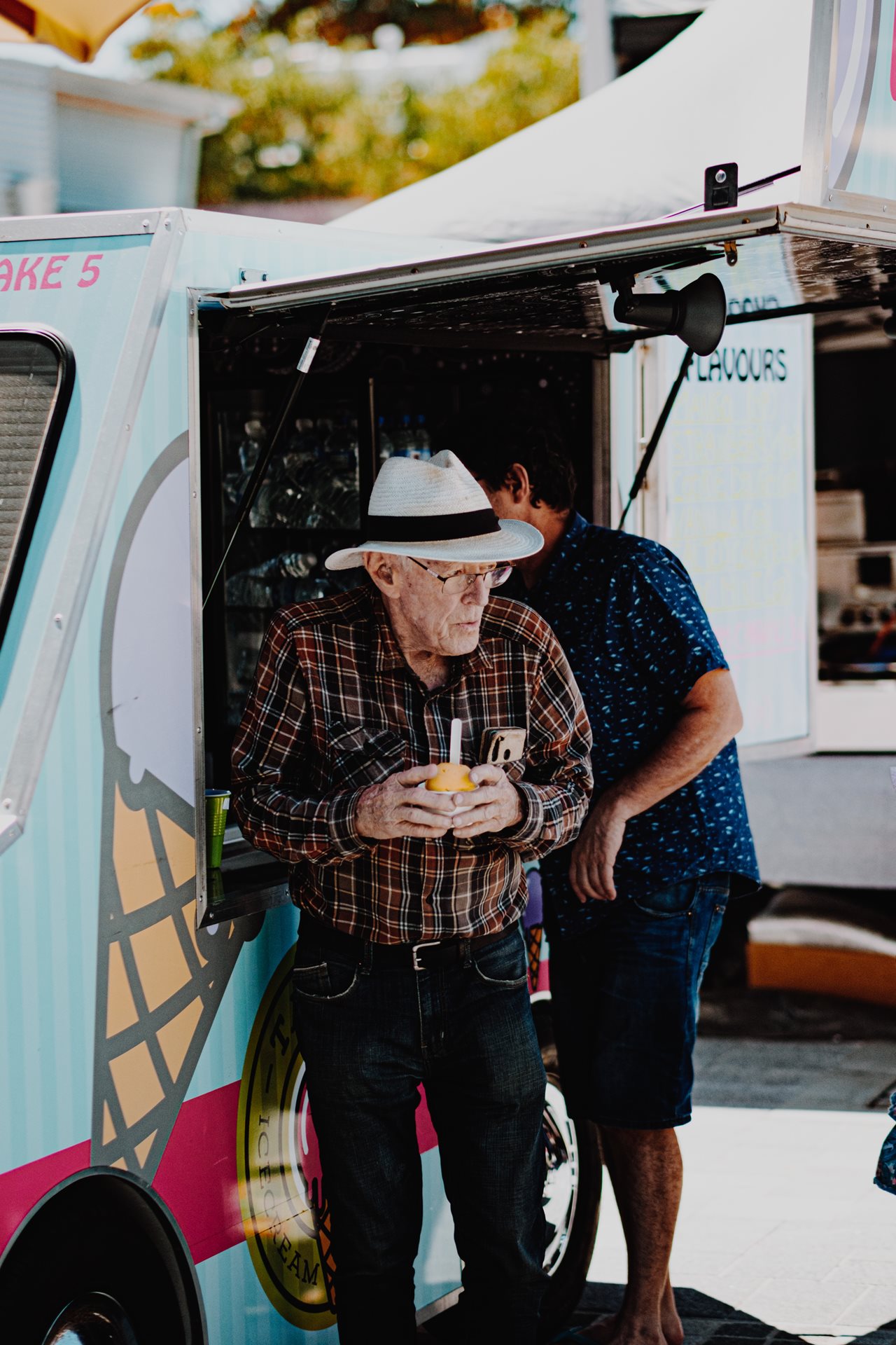 Man holding an ice-cream cone at the ONE Subiaco market for the opening of Seddon Street