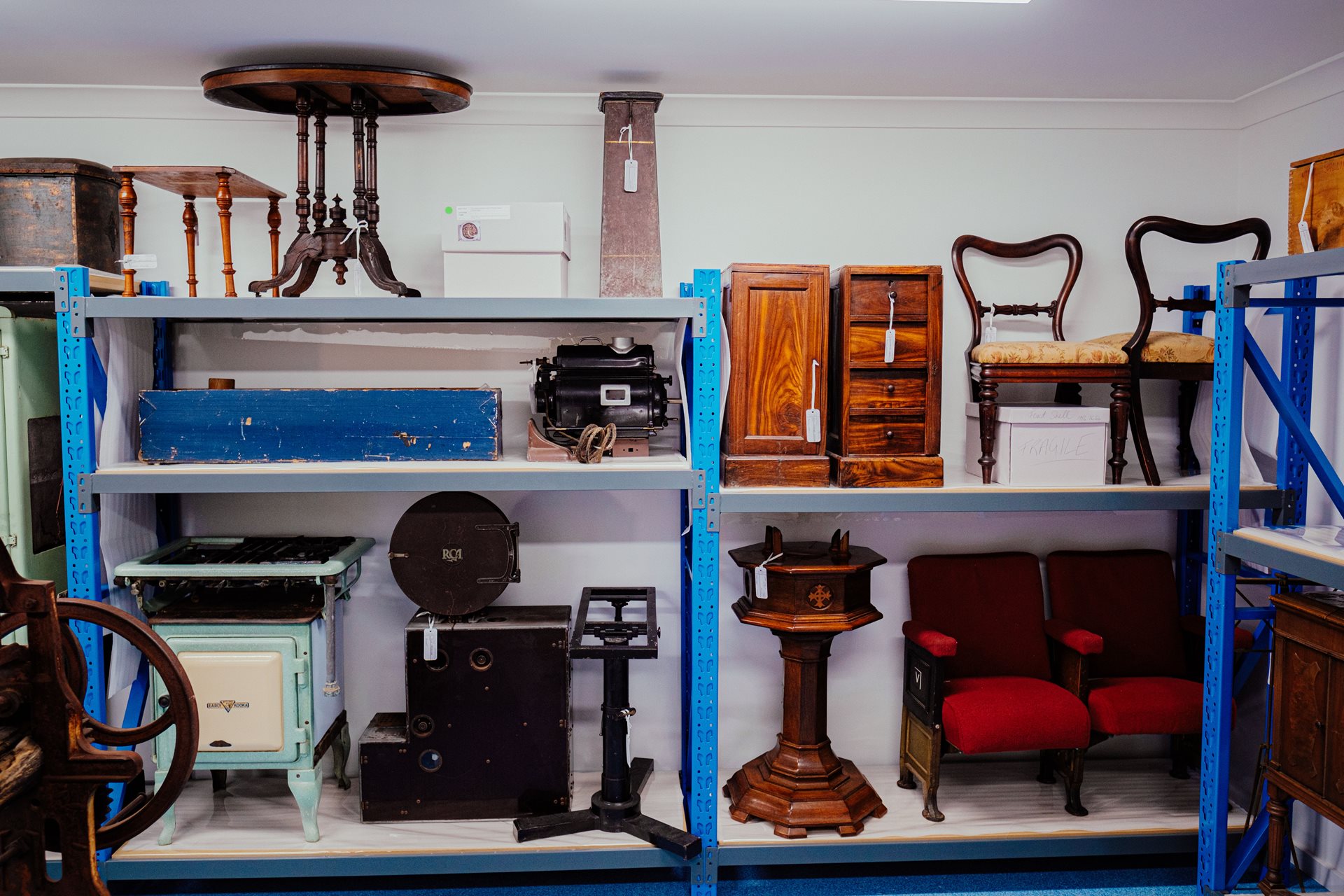 Image of shelves with items from the museum collection stored within